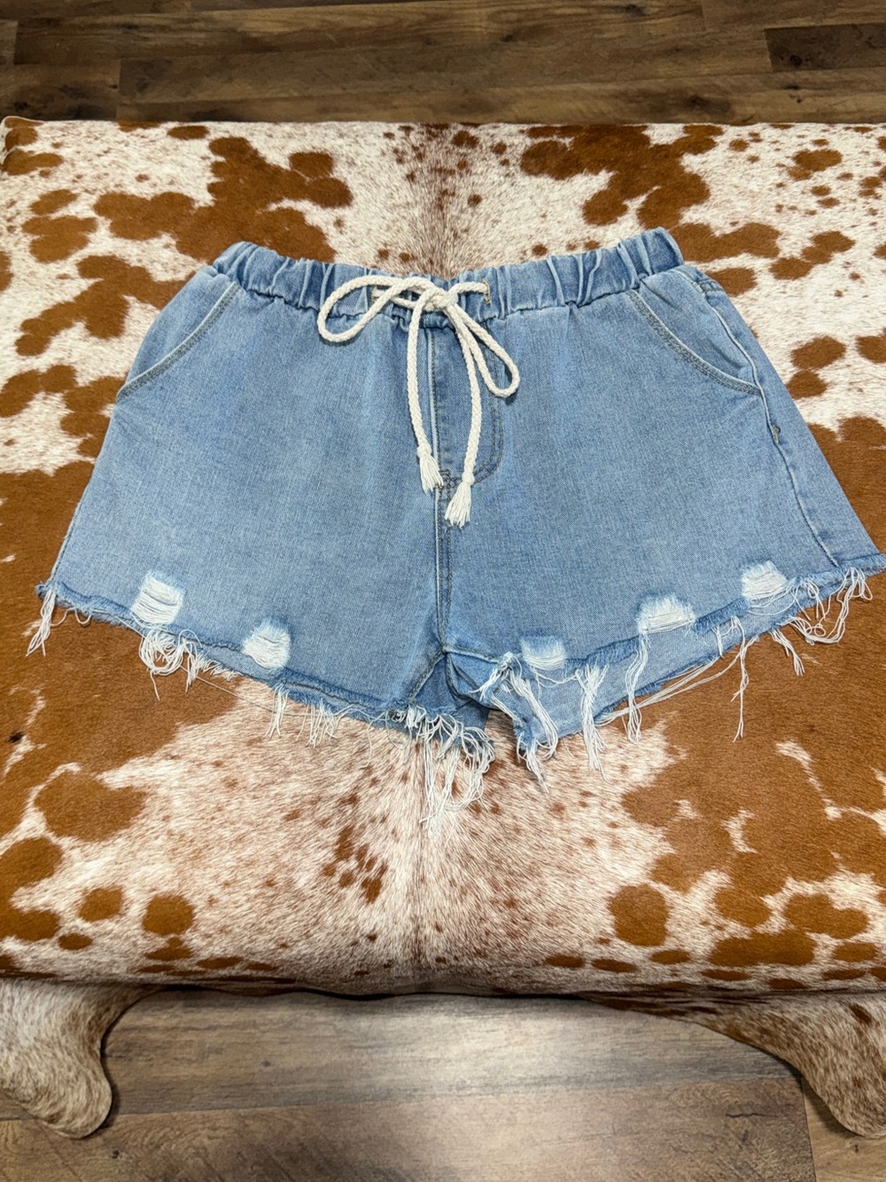 Women's Light Blue Distressed Denim Shorts with Drawstring Waist